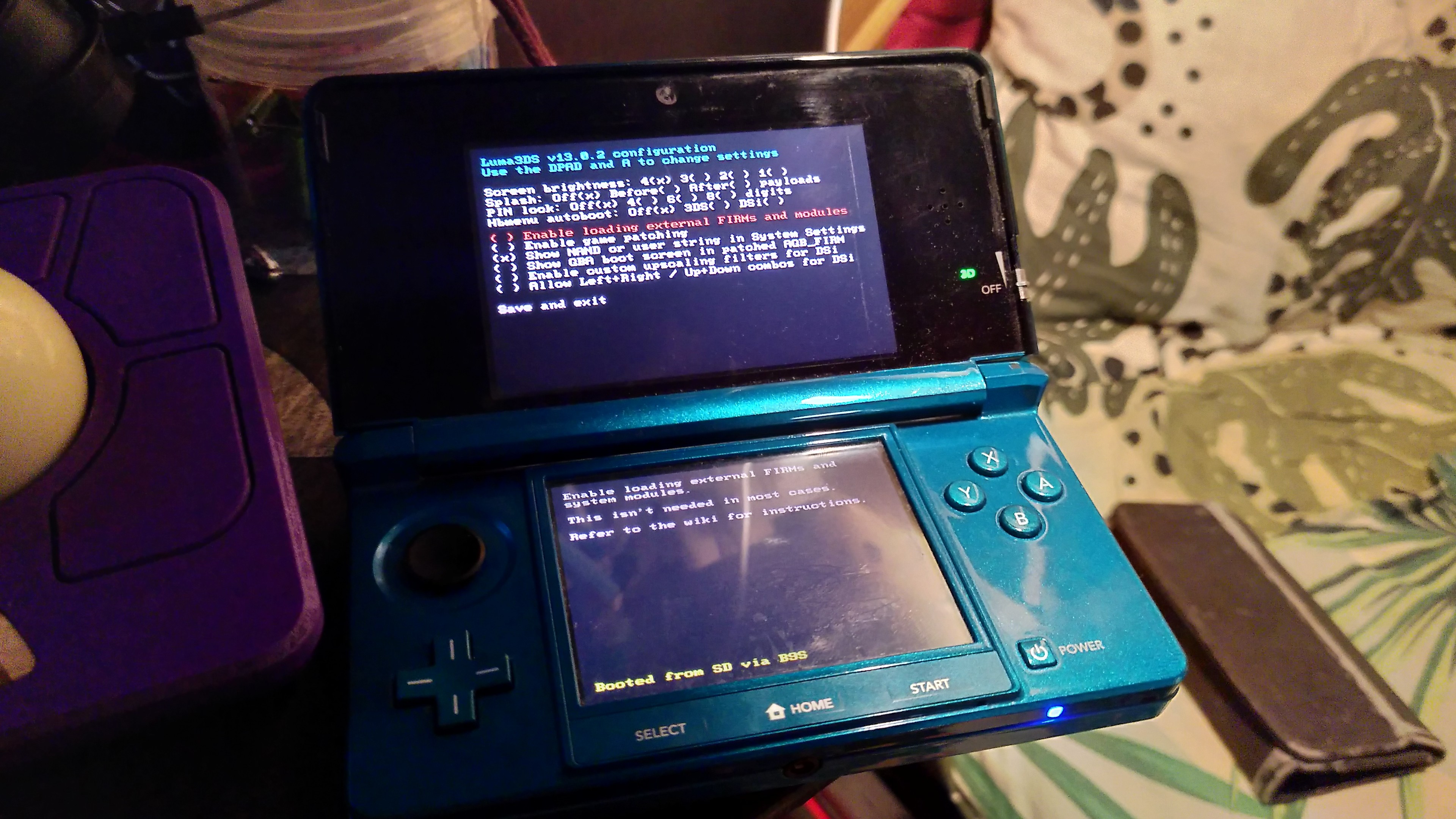 A blue 3DS showing for the first time the luma settings screen