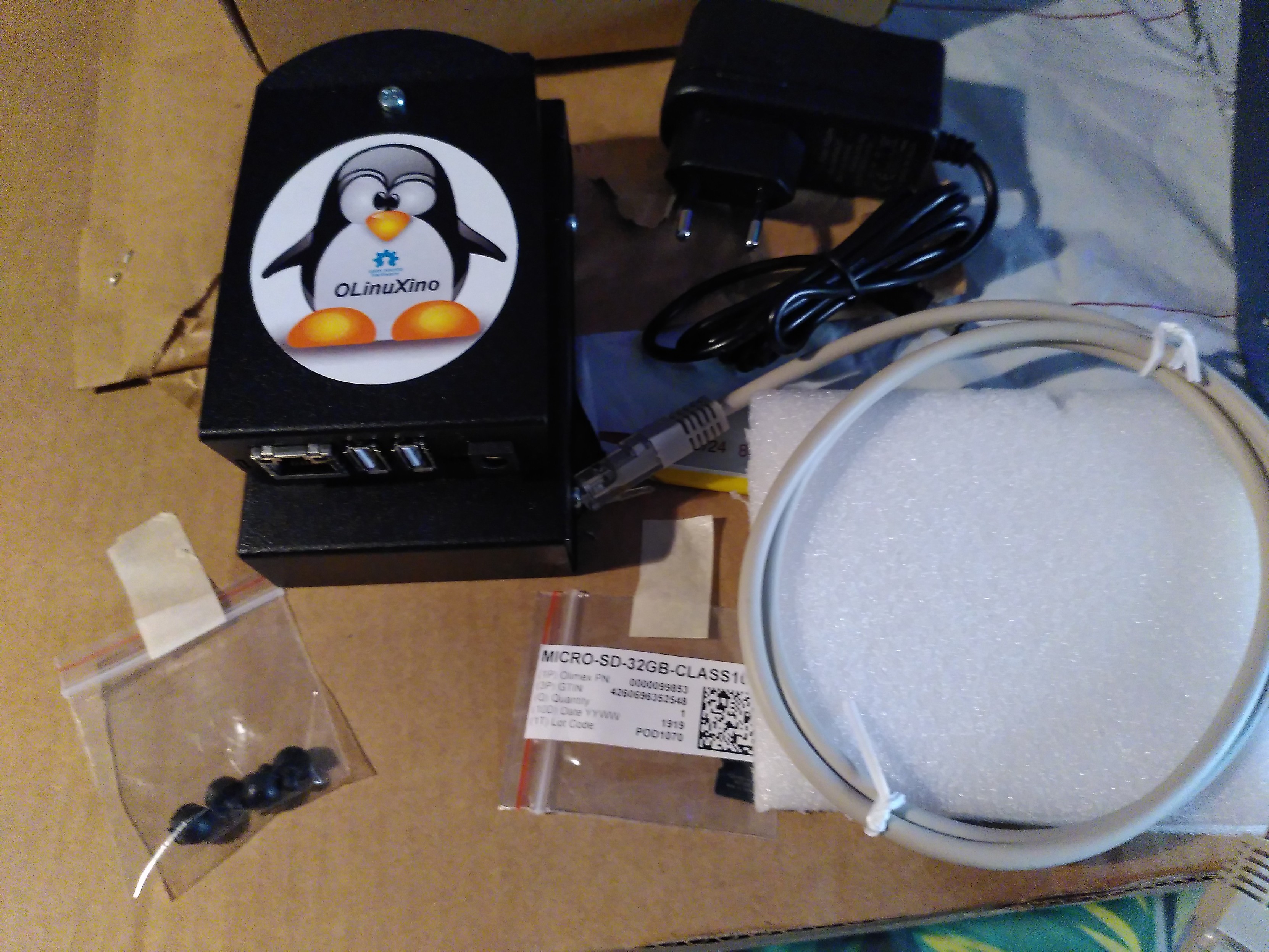 An olimex lime2 in a metal box featuring a tux sticker