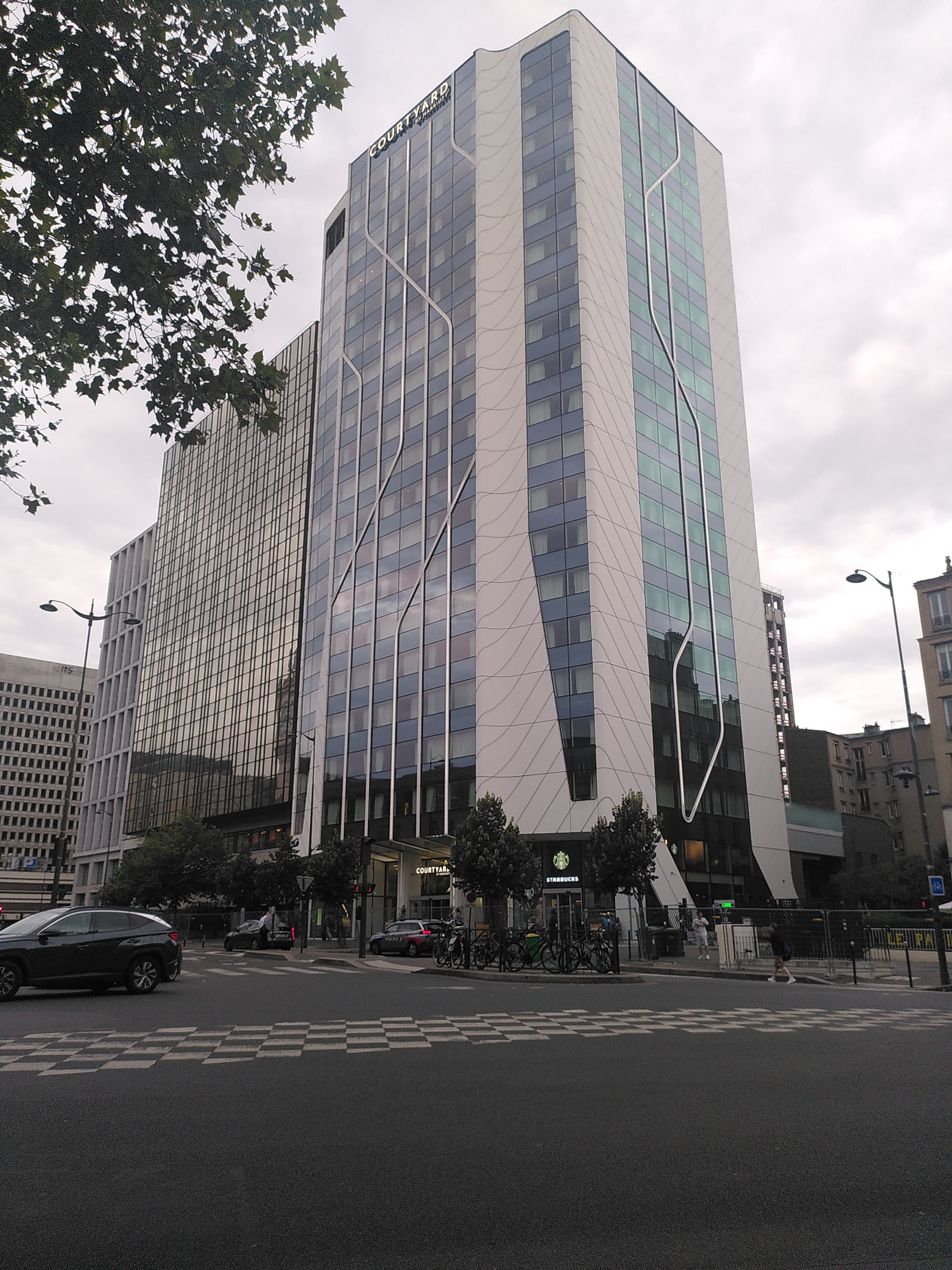 A large building with mostly glass windows