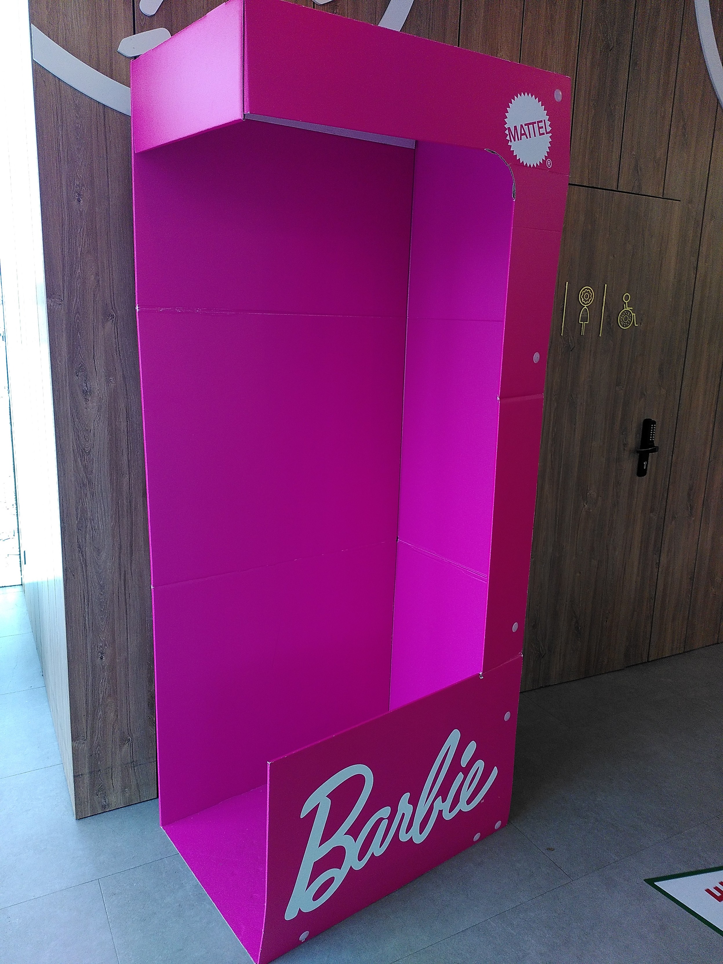A human sized barbie box, open on one side, meant for photo