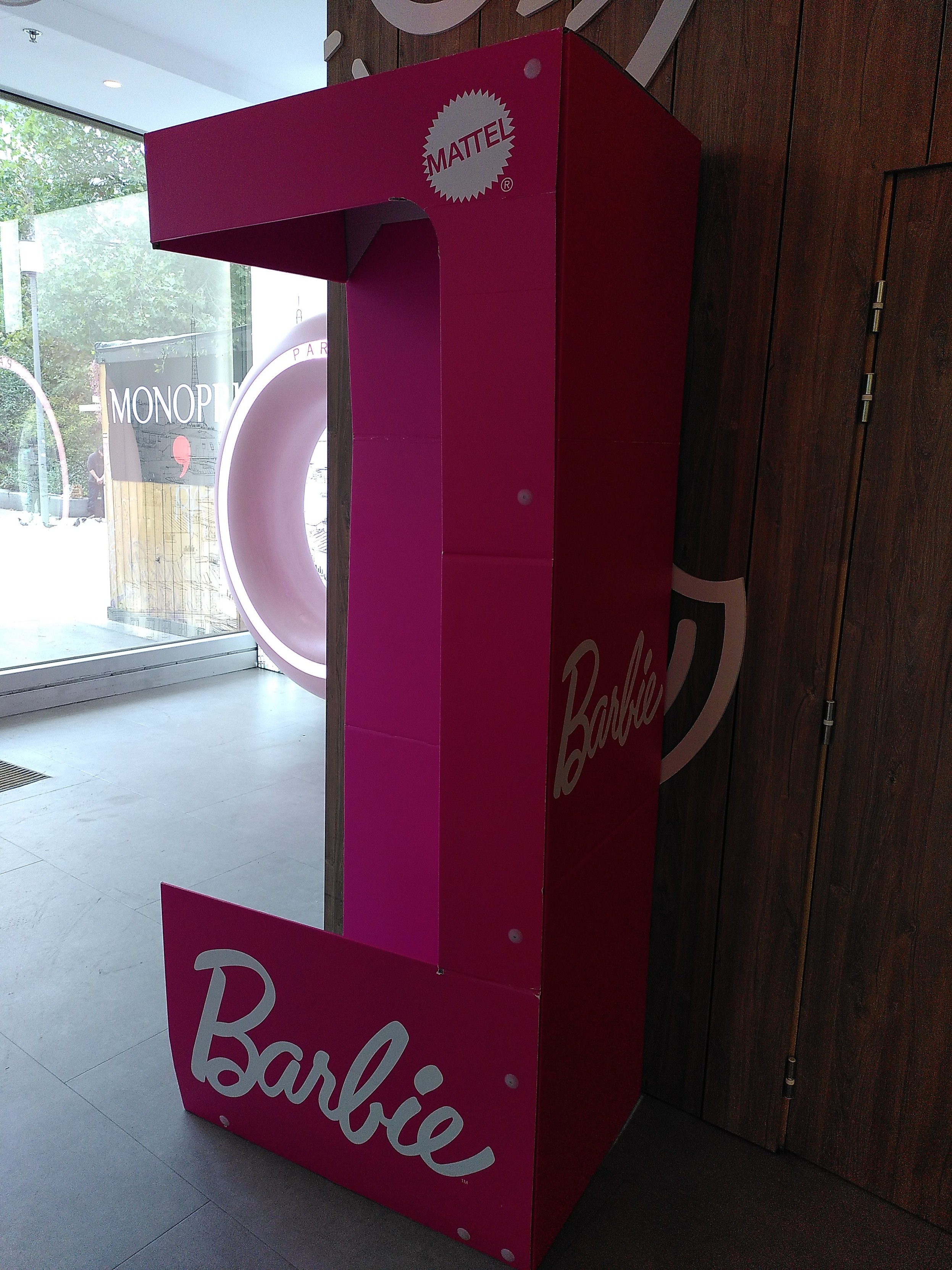 A human sized barbie box, open on one side, meant for photo. Lighting is kinda bad