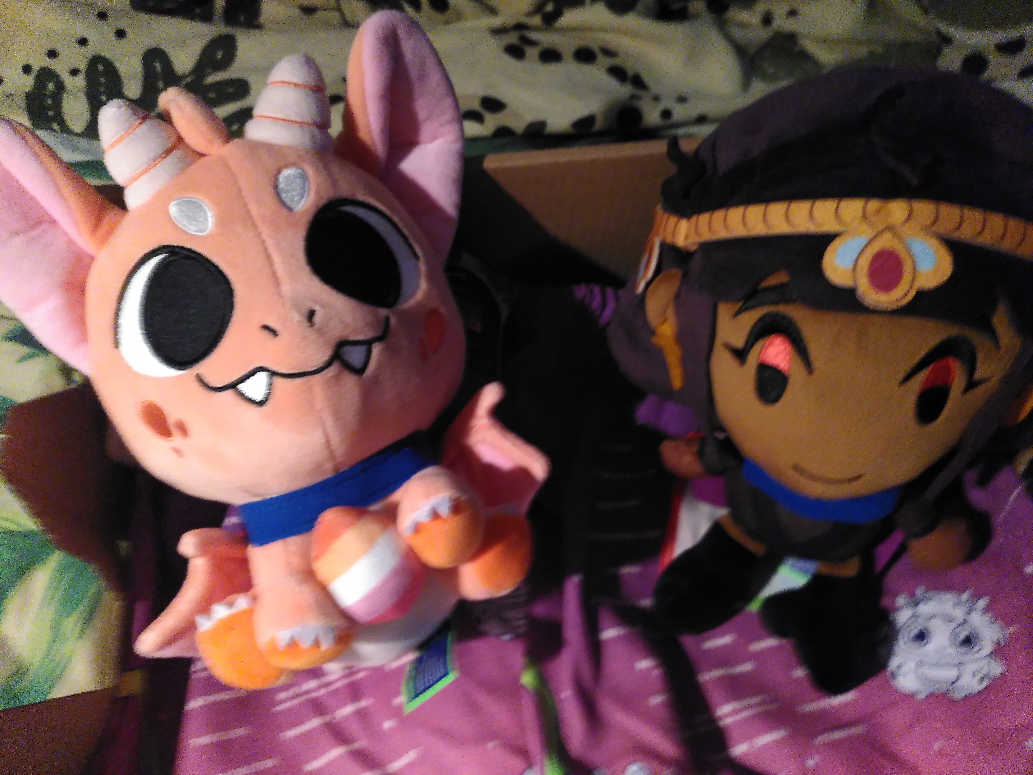 Dani the lesbian dragon and sam anon from get in the car looser, both as makeship plushie
