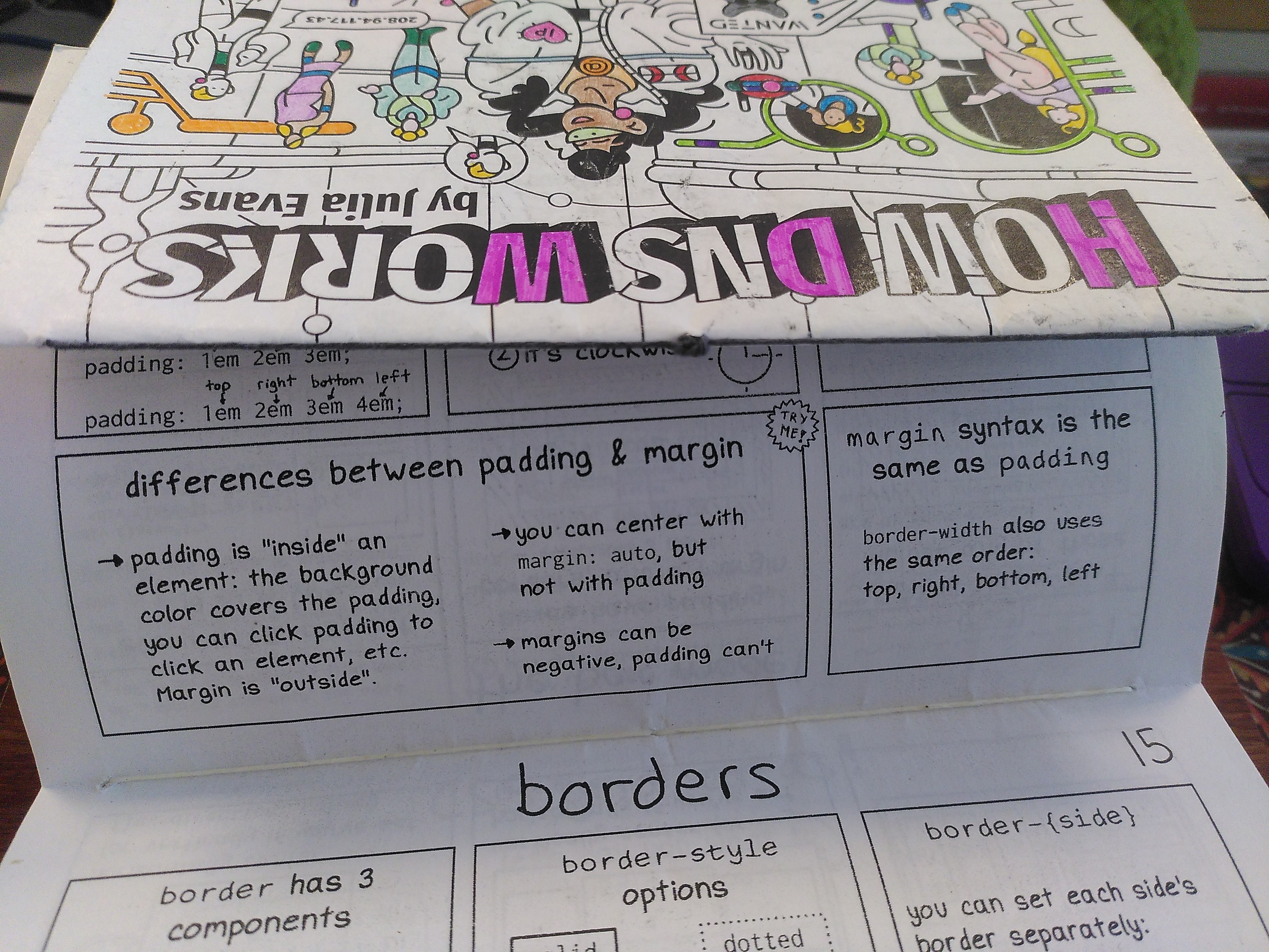 2 zines by julia evans binded with a string