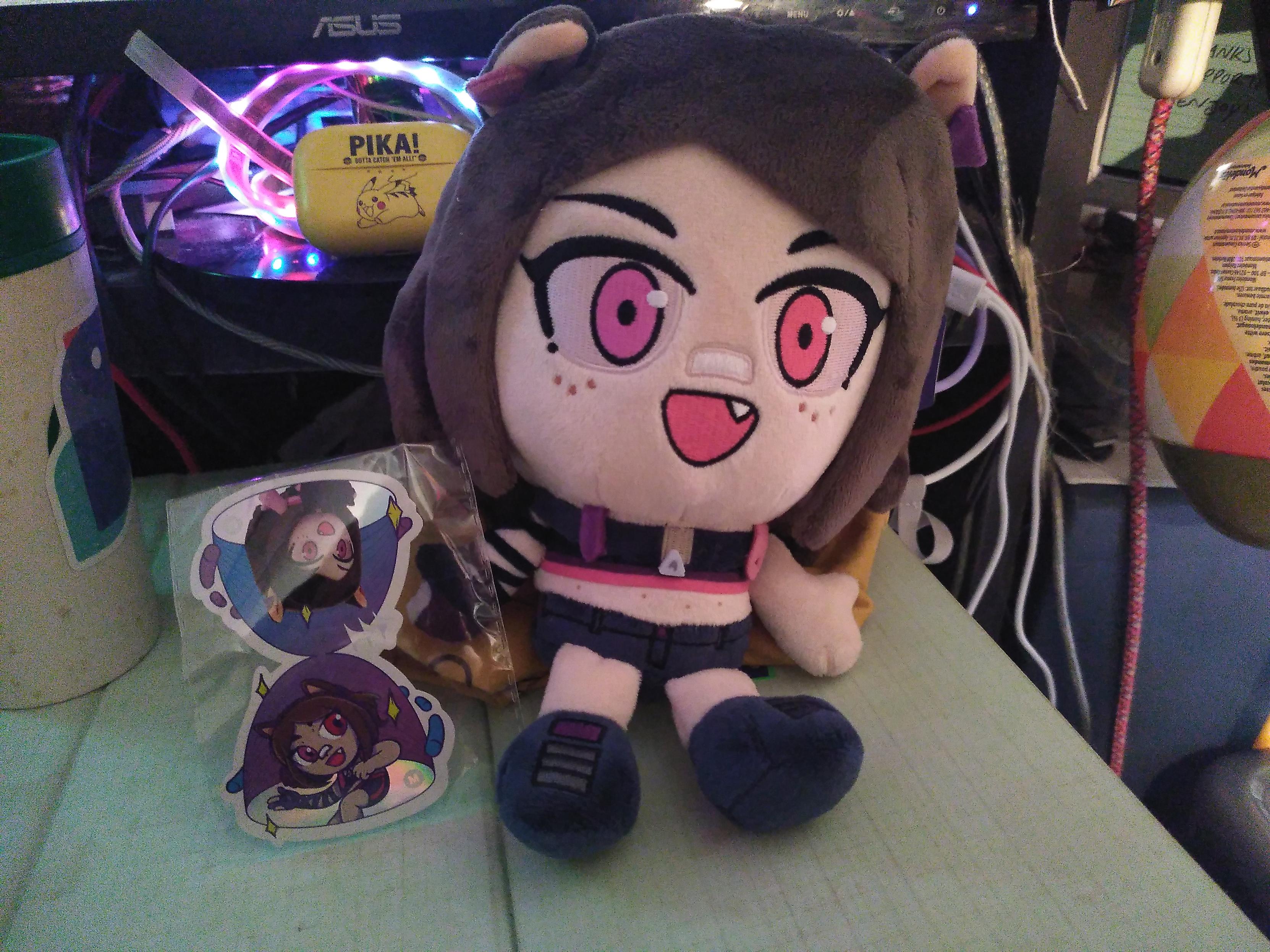 An ascari plushie next to an ascari sticker