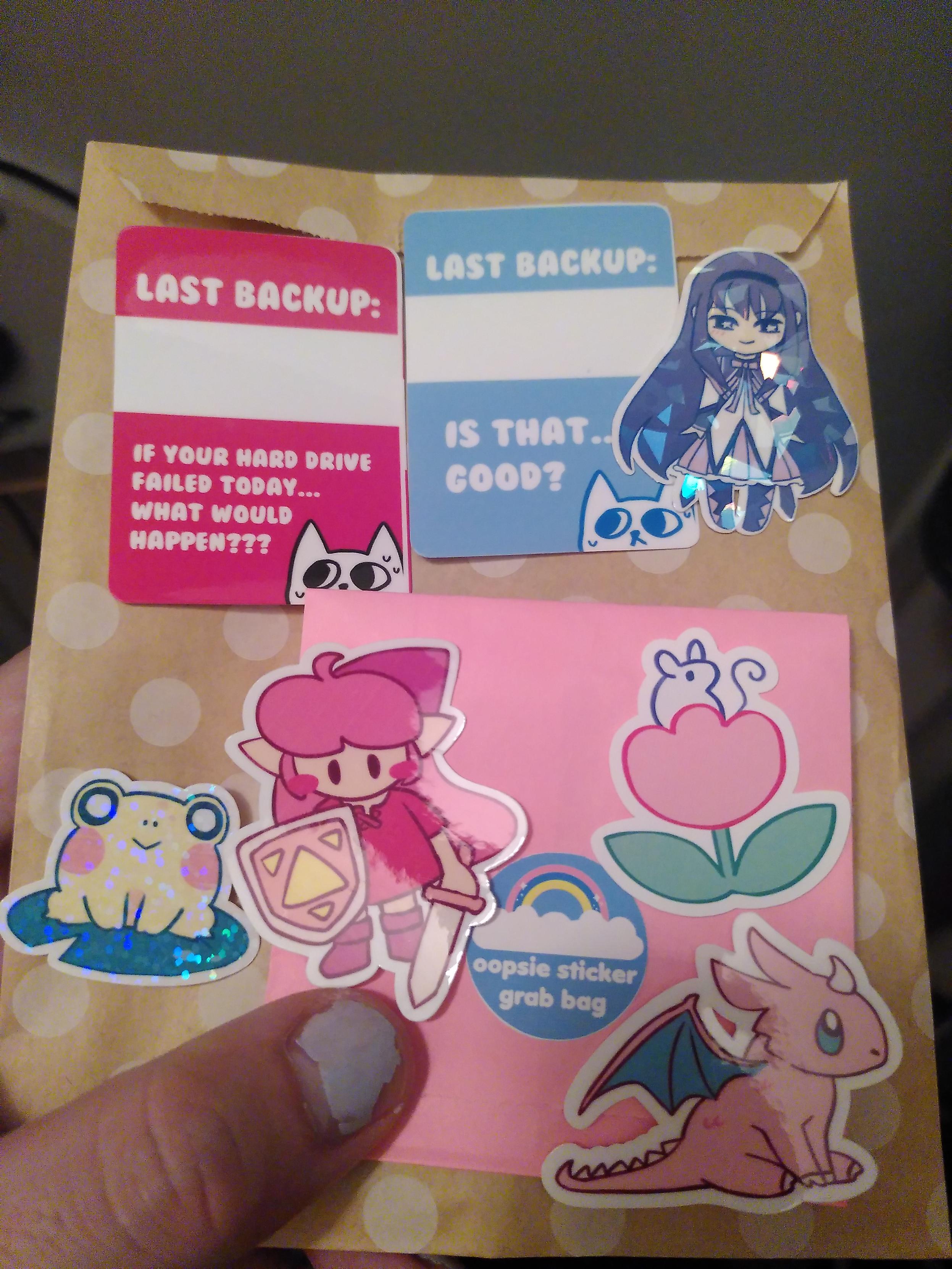 Sticker oopsie grab bag. There are 7 stickers, 3 with minor defect and the other ones looks perfect to me? Designs are two 