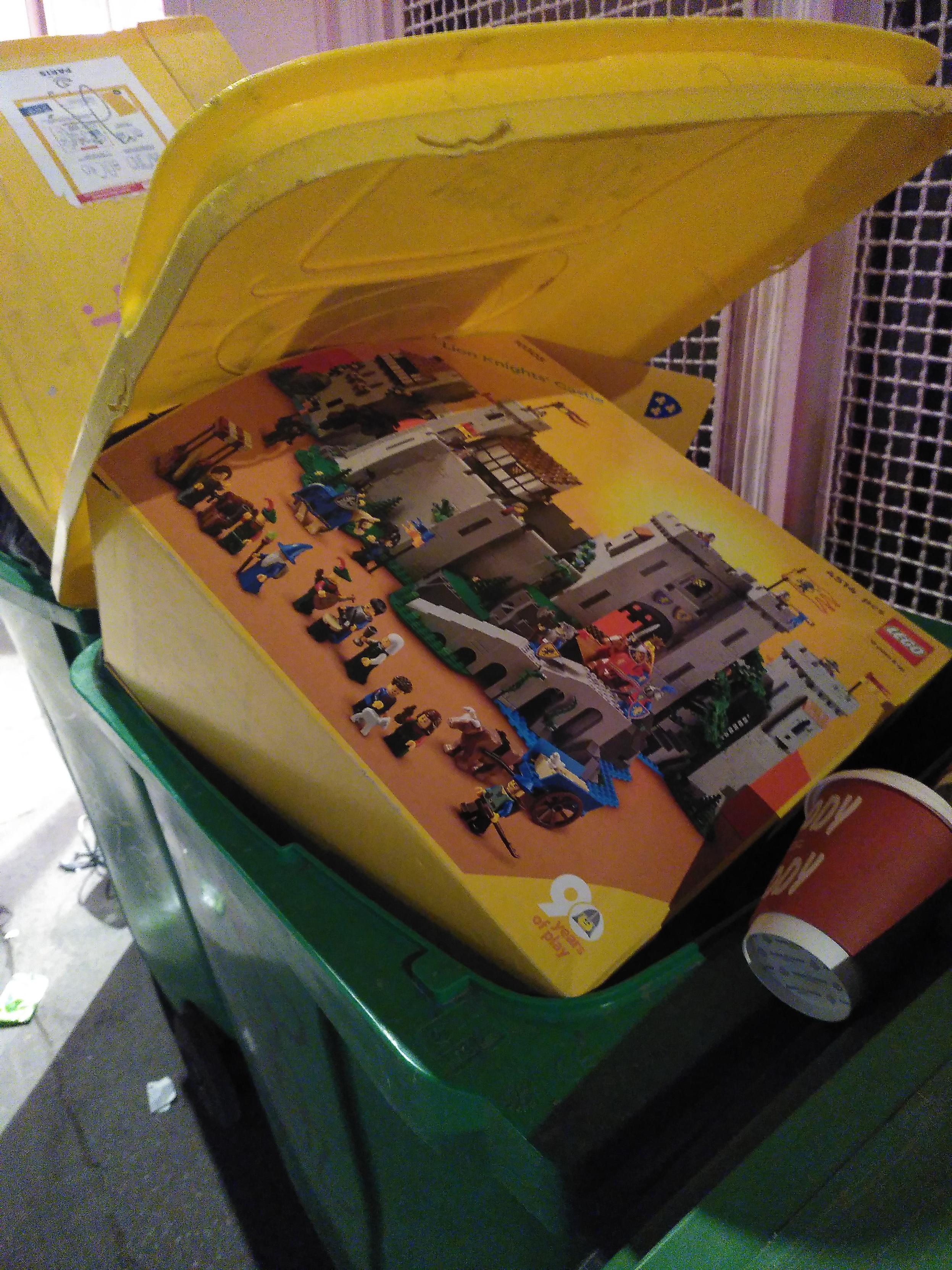 box of a lego castle occupying most of a recycling bin. Neither the box nor the bin are mine.