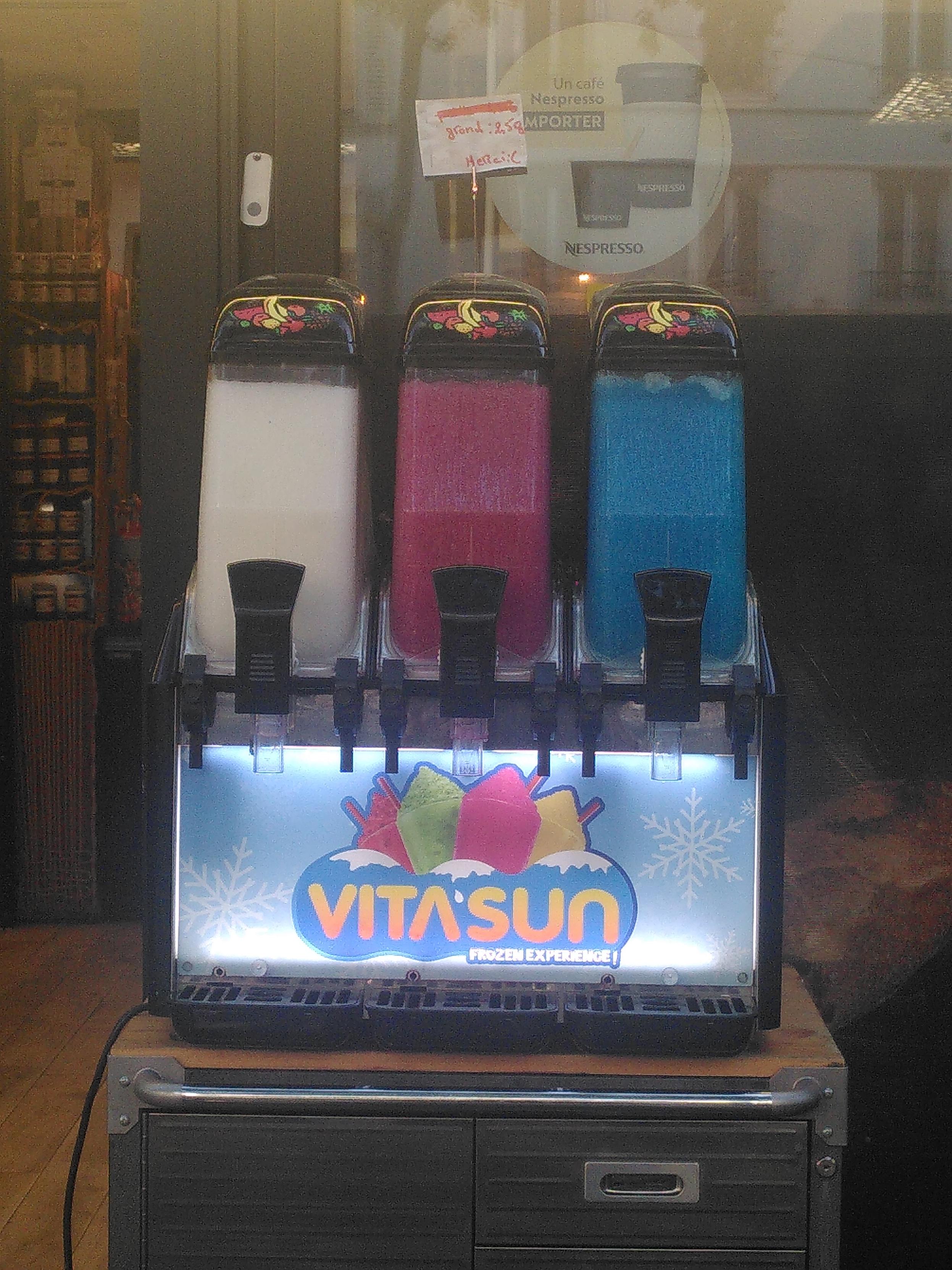 An ice slurry machine with three container. Inside are white ice slurry, dark pink ice slurry and blue ice slurry