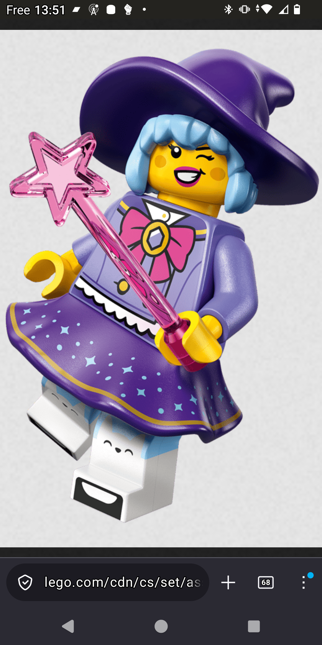 Screen cap of a pretty witch lego minifigurine, posed in a way not possiblr with toys. She have a purple hat, pastel blue chin length hair, some light make-up, lavender top with a big sailor-moon style bow at her neck, a purple dotted with blue night sky stars skirt, legging with upper part pastel blue and lower part white, with kitty face and ears at knee level. She is holding a translucent pink wand ending with a star
