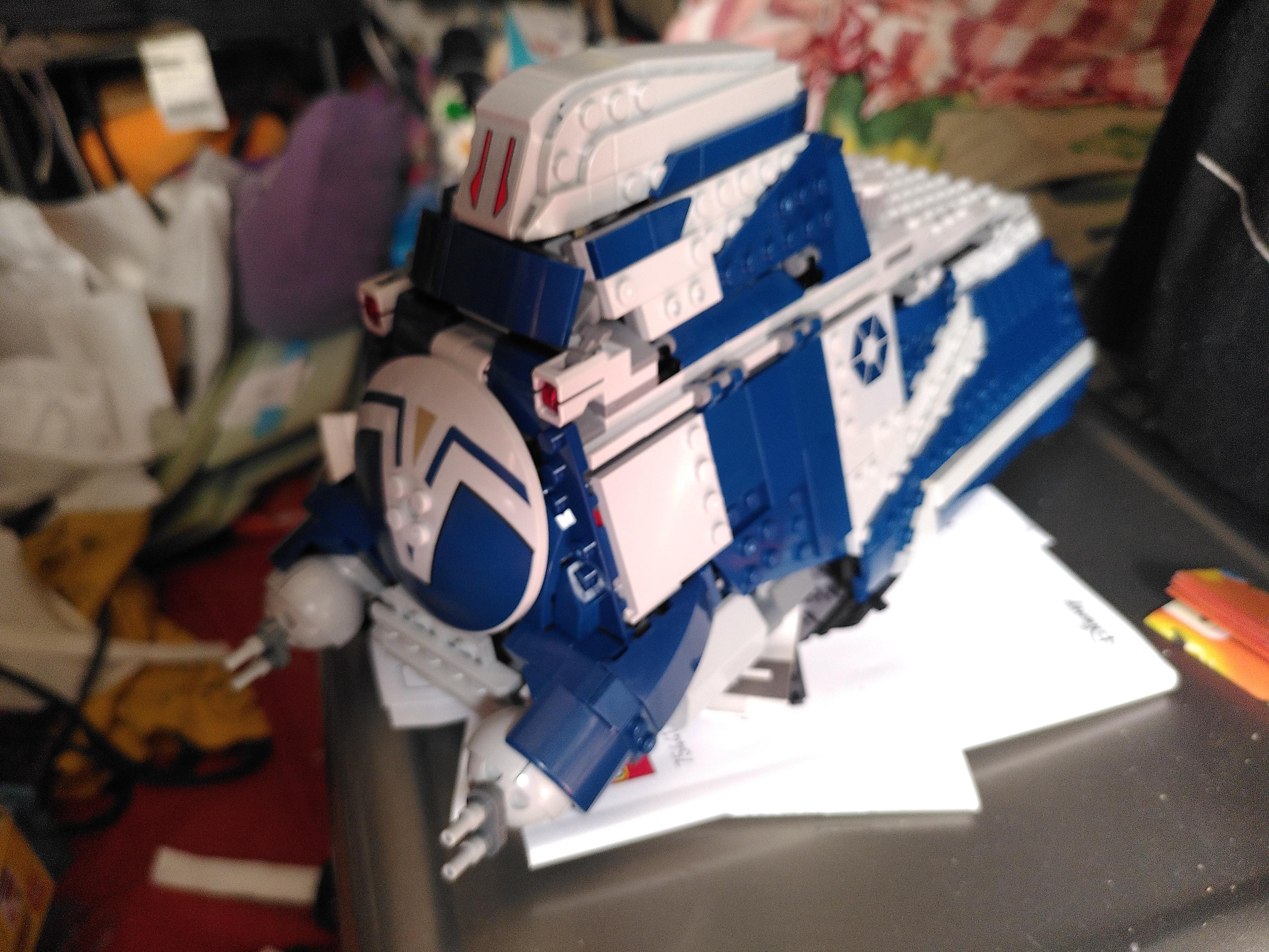 photo of a finished lego MTT. It's a star wars ground vehicle in dark blue and light gray colorscheme